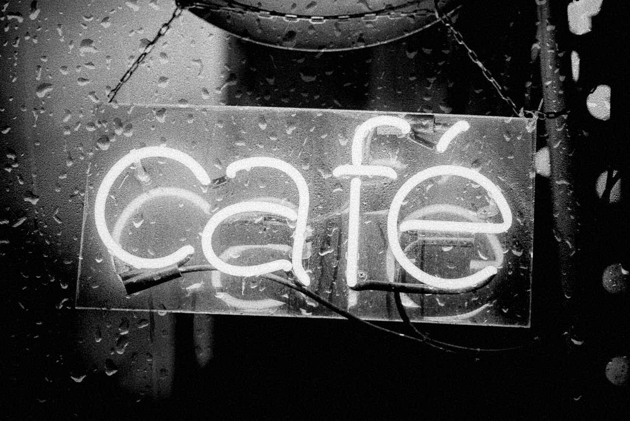 CAFE neon red Sign during heavy raining Night, electronic Sign for Cafe